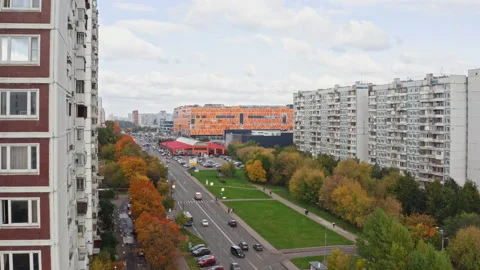 Drone video - The drone flies out from behind on building overlooking the mall Stock Footage 173429288