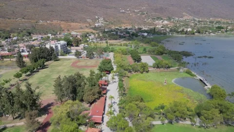 Drone video flying forward through green park and open space at Jocotepec Vídeos de archivo 318917050