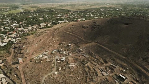 Drone video. Flying over an old village in the desert. Church, mountains. Stock Footage 251993587