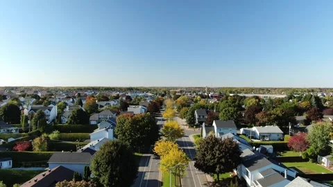 Drone video flying over the trees with colorful leaves on a suburb street o.. 動画素材 256070456