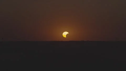 Drone video of Golden Crescent Sun During Solar Eclipse Stock Footage 343923055