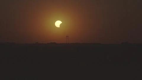 Drone video of Golden Crescent Sun During Solar Eclipse Stock Footage 344057337