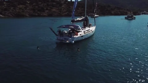 Drone Video of Greece Swim off of Mono-haul Boat Stock Footage