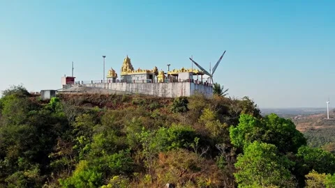 A drone video of historical old hindu temple located on top of hill amidst .. Stock Footage 346704302