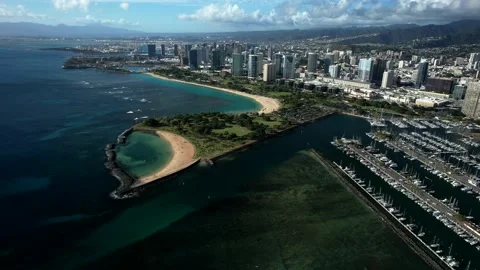 Drone video of Magic Island, the Ala Wai Boat Harbor, and Ala Moana on Oahu, Stockbeeldmateriaal 220826596