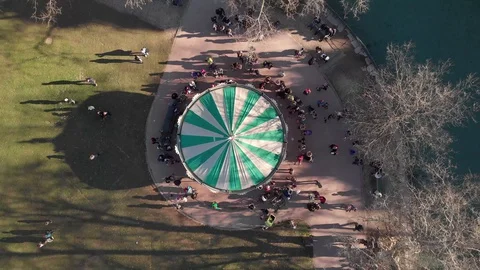 Drone Video of Merry Go Round in a park in France with trees and grass Stock Footage 128809516