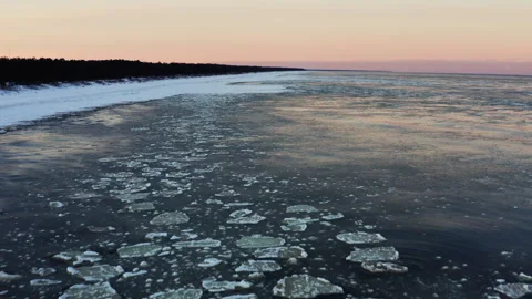 Drone video over the Baltic Sea during winter. A snowy coastline,a freezing sea. Stock Footage 290299623