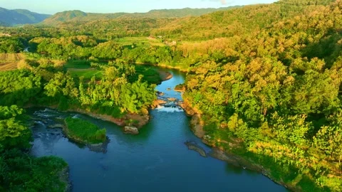 Drone video over lush river valley and hills Stock Footage 336314797