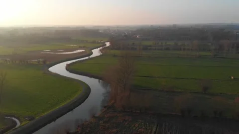 Drone video over a river called the dender in flanders belgium during sunset Stock Footage 169240224