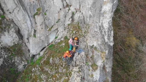 Drone video of people preparing to climb a mountain Stock Footage 206777916