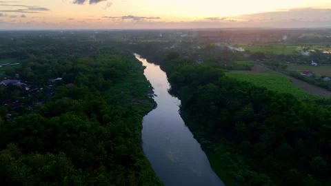 Drone video of reflective river at sunset Stock Footage 336315402