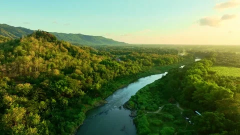 Drone video of river valley glowing at sunset Stock Footage 336315058