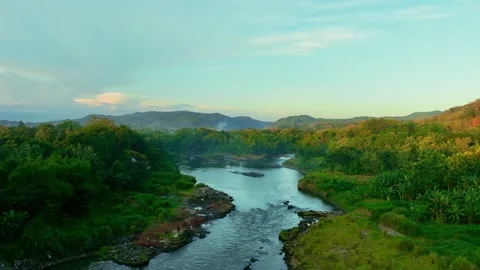 Drone video of rocky river and green hills Stock Footage 336315183