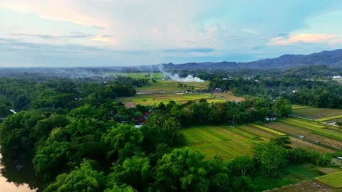 Drone video of rural fields near distant mountains Stock Footage 336315236