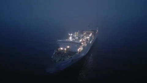 Drone video showcases an empty big ferryboat sailing through the foggy sea at Stock Footage 237026313