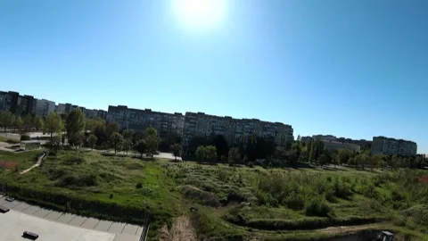 Drone video of a small town with green trees, grass and tall buildings Stock Footage 337651750