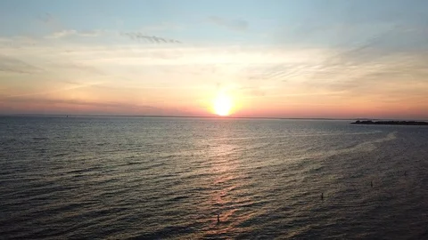 Drone video of sunset over ocean 動画素材 92965832