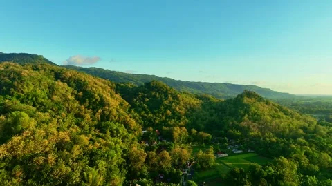 Drone video of sunset river across forest hills Stock Footage 336314943