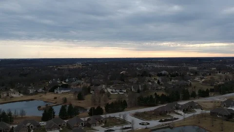 Drone Video of Sunset in small town - houses and pond sunset footage 库存影片 125402427