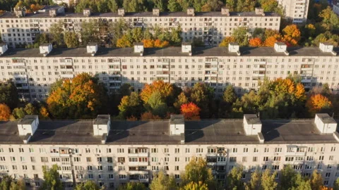 Drone Video -  Three Panel houses in autumn in the light of the sun Stock Footage 173429413