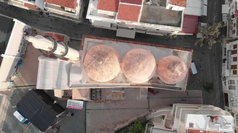 Drone video top view of a mosque in Greece surrounded by buildings and houses Stock Footage 128190488