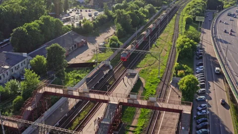 Drone Video - Tracking Shot of Passenger train pulls into the station Stock Footage 173071798