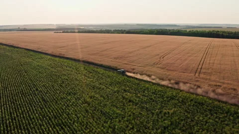 Drone Video - Tracking Shot of SUV driving on a dusty countryside road Stock Footage 172544935