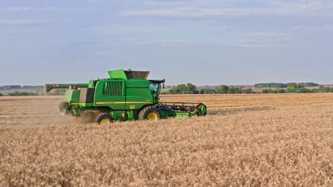 Drone Video - Tracking Shot Of Wheat Harvesting with a John Deere Combine Stock Footage 172524264