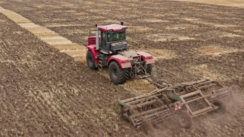 Drone Video - Tractor plows the field for sowing Stock Footage 172503721