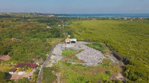 Drone video of waste management, garbage dump on Nusa Lembongan island near Bali Stock Footage 316668363