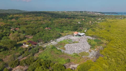 Drone video of waste management, garbage dump on Nusa Lembongan island near Bali Stock Footage 316668464