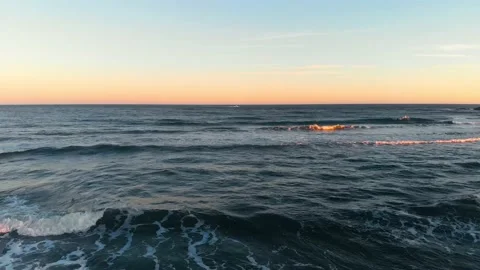 Drone video of waves breaking on the beach Stock Footage 230909583