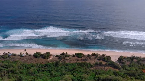 Drone video of a wild empty beach in Bali.  Stock Footage 127588675