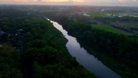 Drone video of winding river under sunset sky Stock Footage 336315470