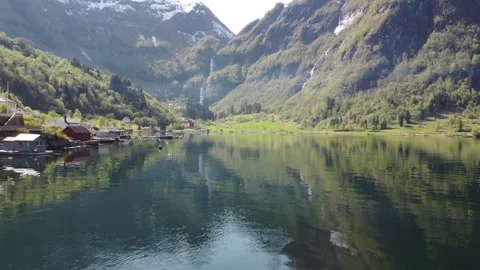 Drone viel pushing forward over water in Norwegian fjord Stock Footage 314841832