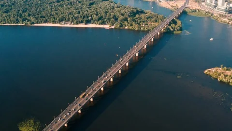 Drone view 4K Flying right above the bridge over which the cars are traveling Stock Footage 111877064