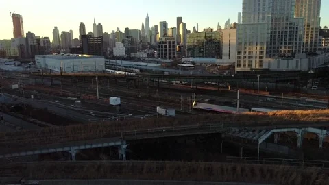 Drone view of the 7 train &amp; the Long Island Rail Road at hunters Point Stock Footage 144840005