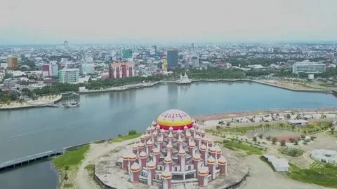 Drone view of a 99 dome mosque and Losari beach in Makassar Stock Footage 161531767