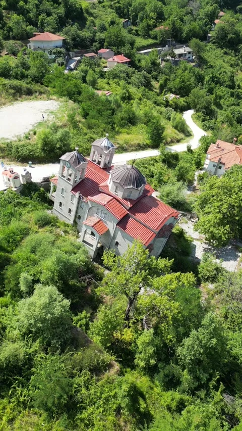 Drone view of abandoned leaning Panagia Theotokou church damaged by landslide Stock Footage 339433763