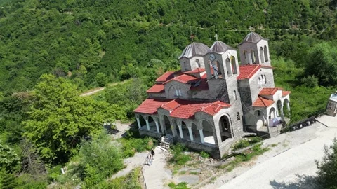 Drone view of abandoned leaning Panagia Theotokou church damaged by landslide Stock Footage 339433893