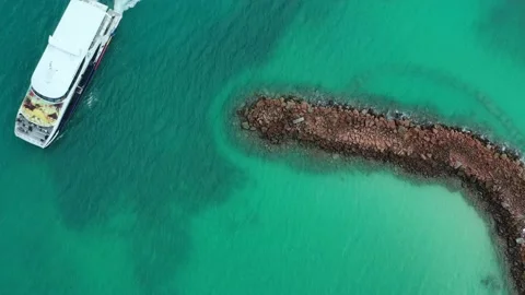 Drone view from above of ferry crossing clear water Seychelles Stock Footage 152258740