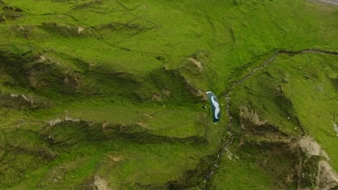 Drone view above paraglider soaring over lush Achill Island terrain, Stock Footage 260999068