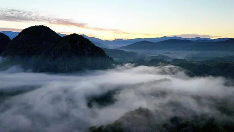 Drone View Above Sea of Clouds at Sunrise Over Meratus  Mountains in Borneo Vidéo 335066385