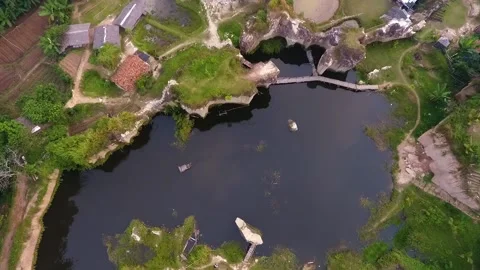 Drone view from above a small lake and some people's houses Stock Footage 213918992