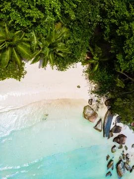 Drone view from above at a tropical beach in the Seychelles, Anse Source d'.. Stock Photos