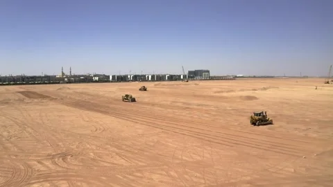 Drone view across earthwork ridges and construction vehicles 库存影片 346430488