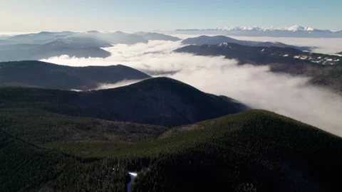 Drone view across snowy Carpathian terrain reveals mountain contours Stock Footage 345898089
