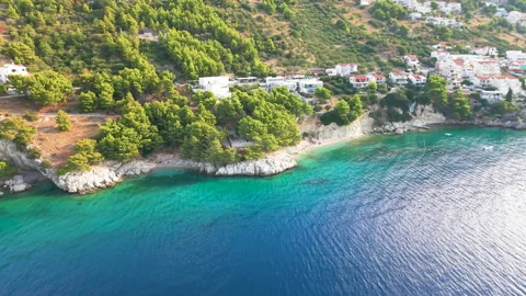 Drone view of an Adriatic coastal town with turquoise sea Stock Footage 344426697