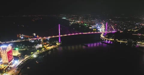 Drone view, Aerial view of Bai Chay bridge at night in Ha Long City, Vietnam Stock Footage 296853298