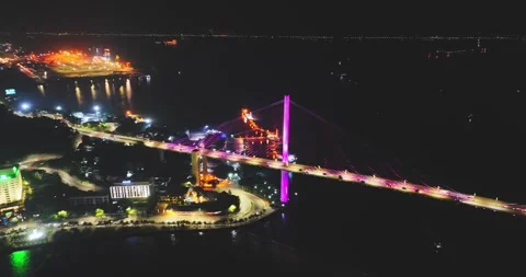 Drone view, Aerial view of Bai Chay bridge at night in Ha Long City, Vietnam Stock Footage 296853516